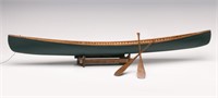 A 27-INCH HAND MADE WOOD CANOE MODEL