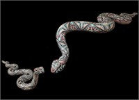 A PAIR OF ARTISAN-SCULPTED POLYMER CLAY SNAKES