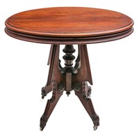 A 19TH C. WALNUT VICTORIAN PARLOR TABLE WITH OVAL
