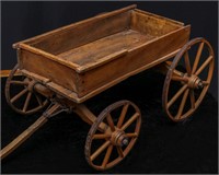 AN ANTIQUE CHILD'S COASTER WAGON WITH WOOD SPOKE