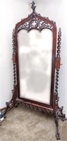A HIGHLY CARVED LATE 20TH CENTURY CHEVAL MIRROR