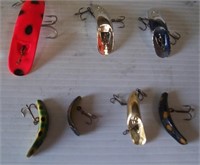 (7) Helin's Flatfish lures of various sizes.