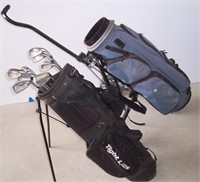 (2) Golf bags (1) set of clubs and a hand cart.
