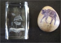 Dolphins in glass and egg with elephant.