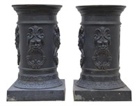 (2) LARGE CAST IRON MASK & RING FLOOR PLANTERS