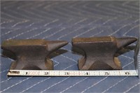 Two small black anvils