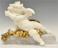 PAINTED PARCEL GILT WINGED CHERUB ON MARBLE BASE