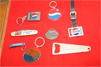 Lot of Pepsi keychains, bottle openers, and a