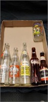 Vintage soda bottles and Flintstone glass
