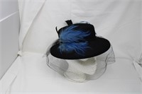 Vintage black hat, feather decorated