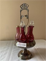 Plated silver cruet set with 5 cranberry glass