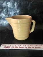 Pottery pitcher with advertising