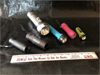 Yardage measuring scopes and flashlights