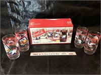 Eight Coca-Cola glasses