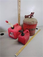 2 plastic gas cans and metal alcohol can
