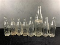 Collection of Vintage Coke Bottles - 8 Total