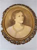 Antique picture in oval wood frame