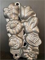 Cast iron John Wright flower mold