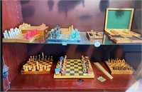 CHESS SETS ON 2 SHELVES