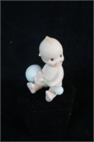 Kewpie Baby with blue rattle   1992
