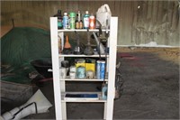 wooden shelf with funnels, lubricants,
