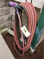 SECTION OF RED GARDEN HOSE