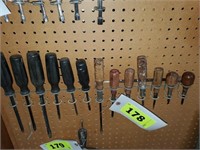 LOT SCREWDRIVERS IN HOLDERS ON WALL