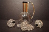 Pitcher and grape bottles