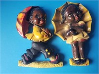 Pair of plaster wall figurines