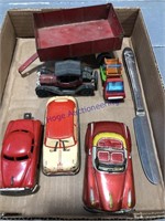Tin cars, red wagon, Charlie McCarthy knife