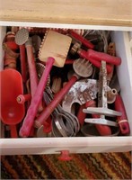 Contents of utensil drawer, vintage red utensils