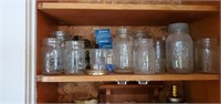 Shelf of canning jars with lids and rubbers