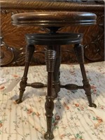 Very old adjustable height stool claw feet