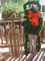 2 runner sleds- 1 is decorated for Christmas and