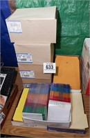 Assorted file jackets, DVD cases & more