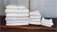 Lot of white towels. 5 plush, 1 small, 4 hand