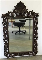 Ornate carved wood mirror