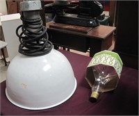 white enamel light fixture with bulb