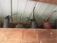 Four oil cans