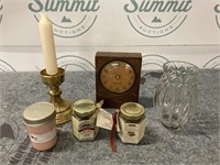 Candles and clock with vase
