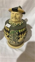 Chinese man beer stein with a pewter thumb lift,
