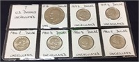 Seven US dollar coins, assorted,