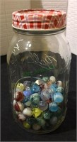 Marbles, ball mason jar half full with
