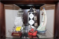 Shelf lot w/ lighthouses, sailboat, owl,