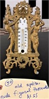 very old cast metal figural thermometer stand
