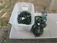 Plastic bin w/ extension cords with timer