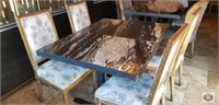 table with metal post, marble like design top.