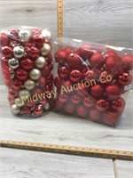 2 CONTAINERS OF RED AND SILVER CHRISTMAS ORNAMENTS