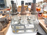 Oil Bottles with spouts and Metal Carrier.