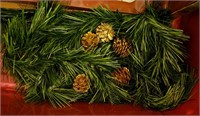 Strand of garland and 5 gold pine cones